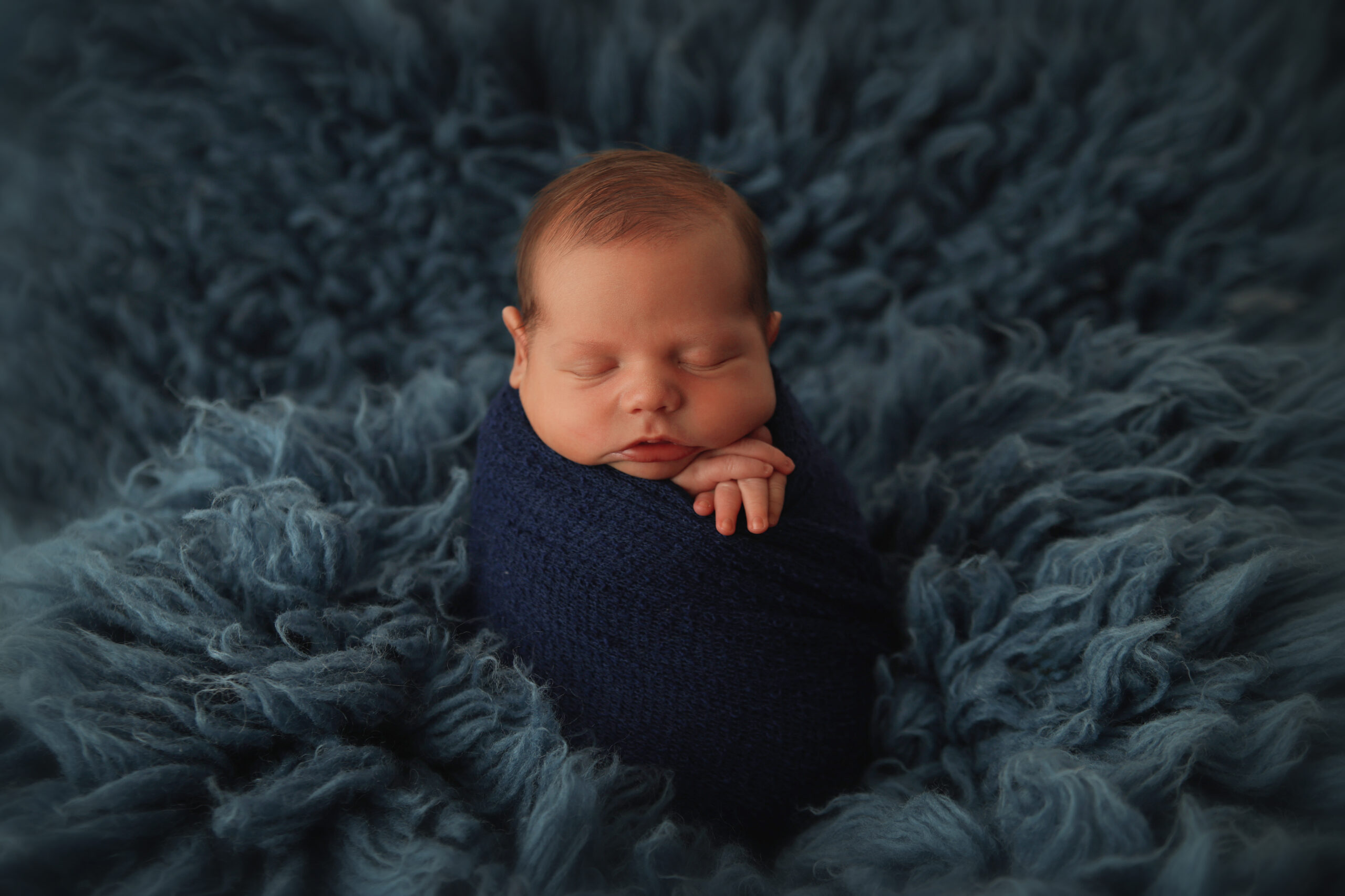 baby boy in all blue in Claremore newborn photography studio 