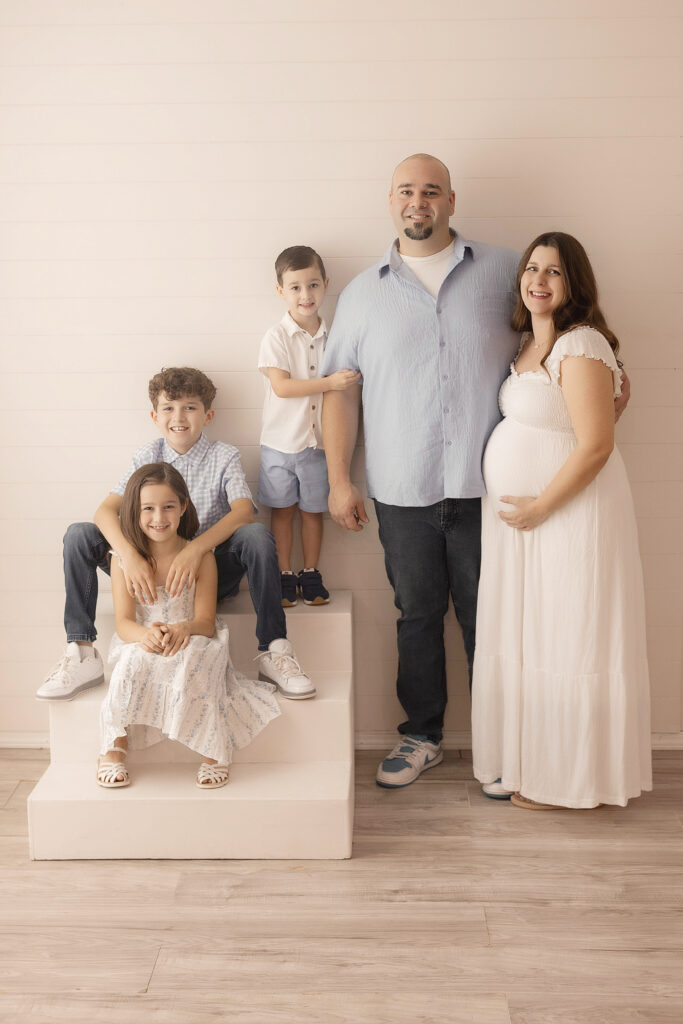 family of 5 in Owasso photography studio for maternity session 
